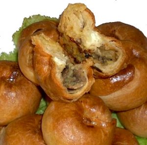 Knishes, with one cut open to show its filling