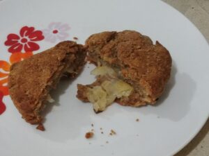 Passover rolls with fried onions inside, made of mostly matzoh meal, with baking powder.