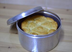 Yemenite Jewish Food features kubaneh, and enriched bread baked inside a closed pot.